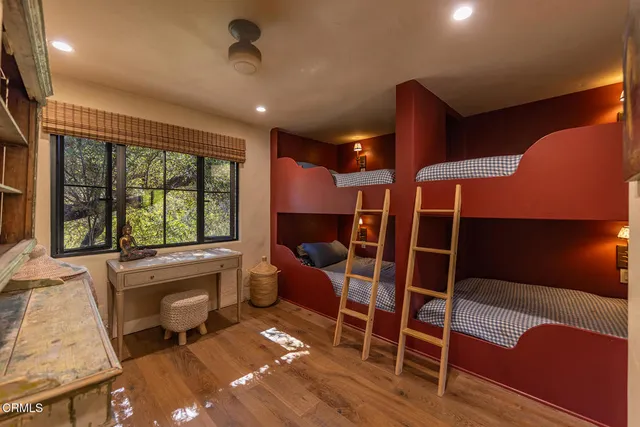 a view of a livingroom with furniture and windows