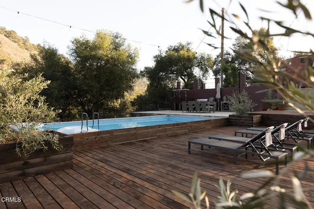 a view of a yard with wooden fence