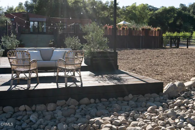 a patio with table and chairs
