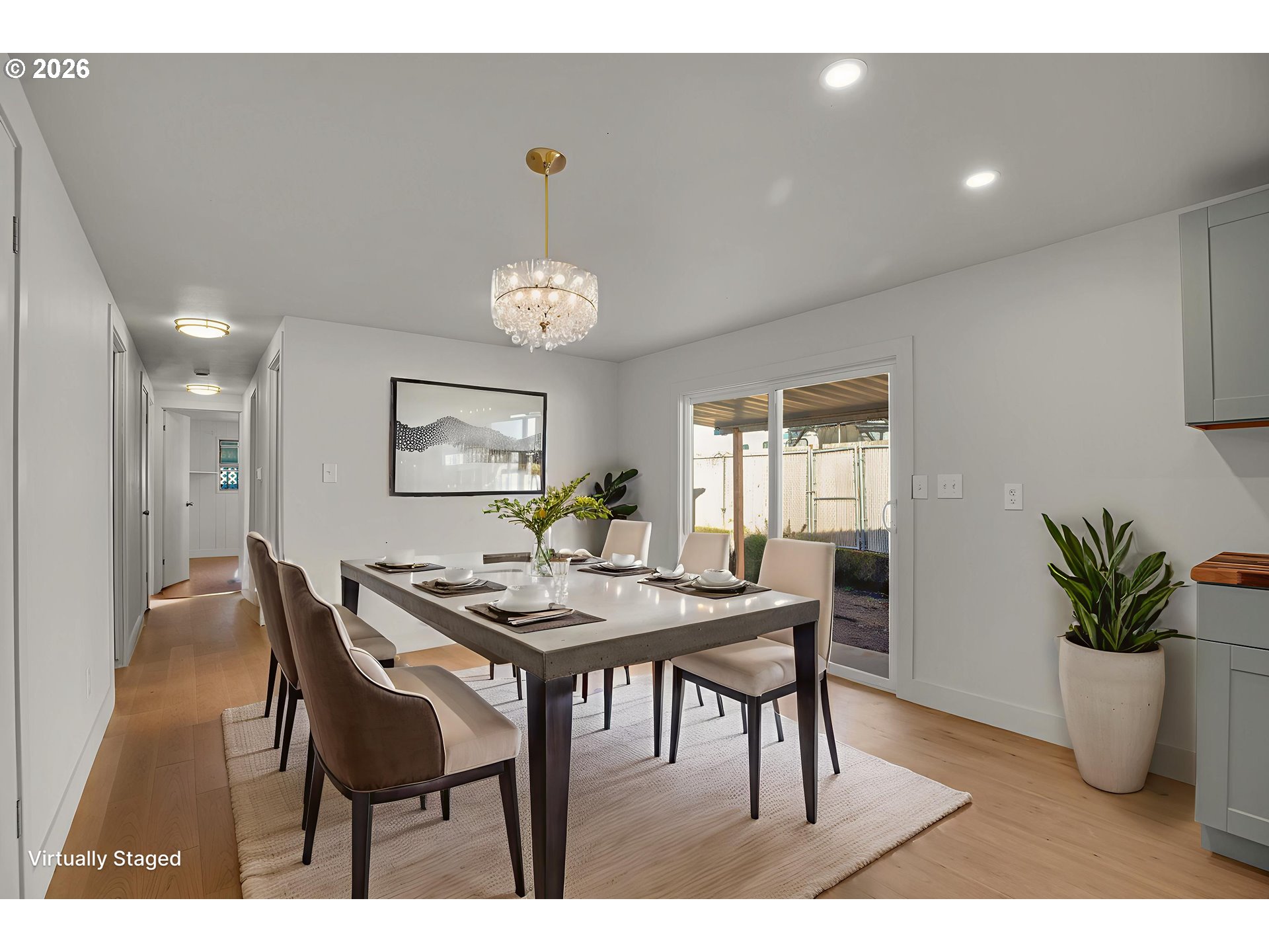 4400 Southeast Roethe Road, Unit 51 Milwaukie, OR 97267 - Photo 12 of 48 a view of a dining room and livingroom with furniture wooden floor and a chandelier