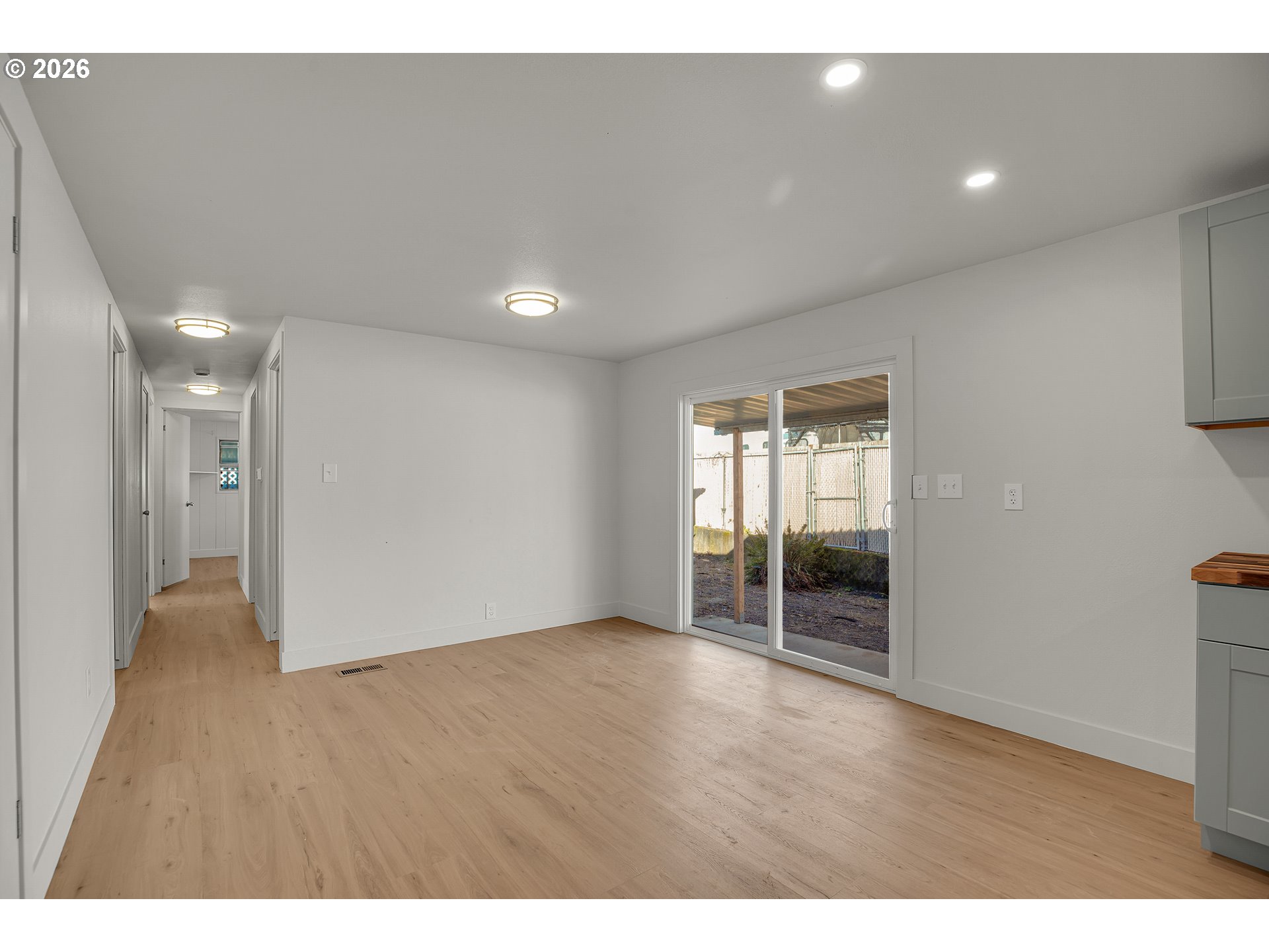 4400 Southeast Roethe Road, Unit 51 Milwaukie, OR 97267 - Photo 13 of 48 a view of an empty room with wooden floor