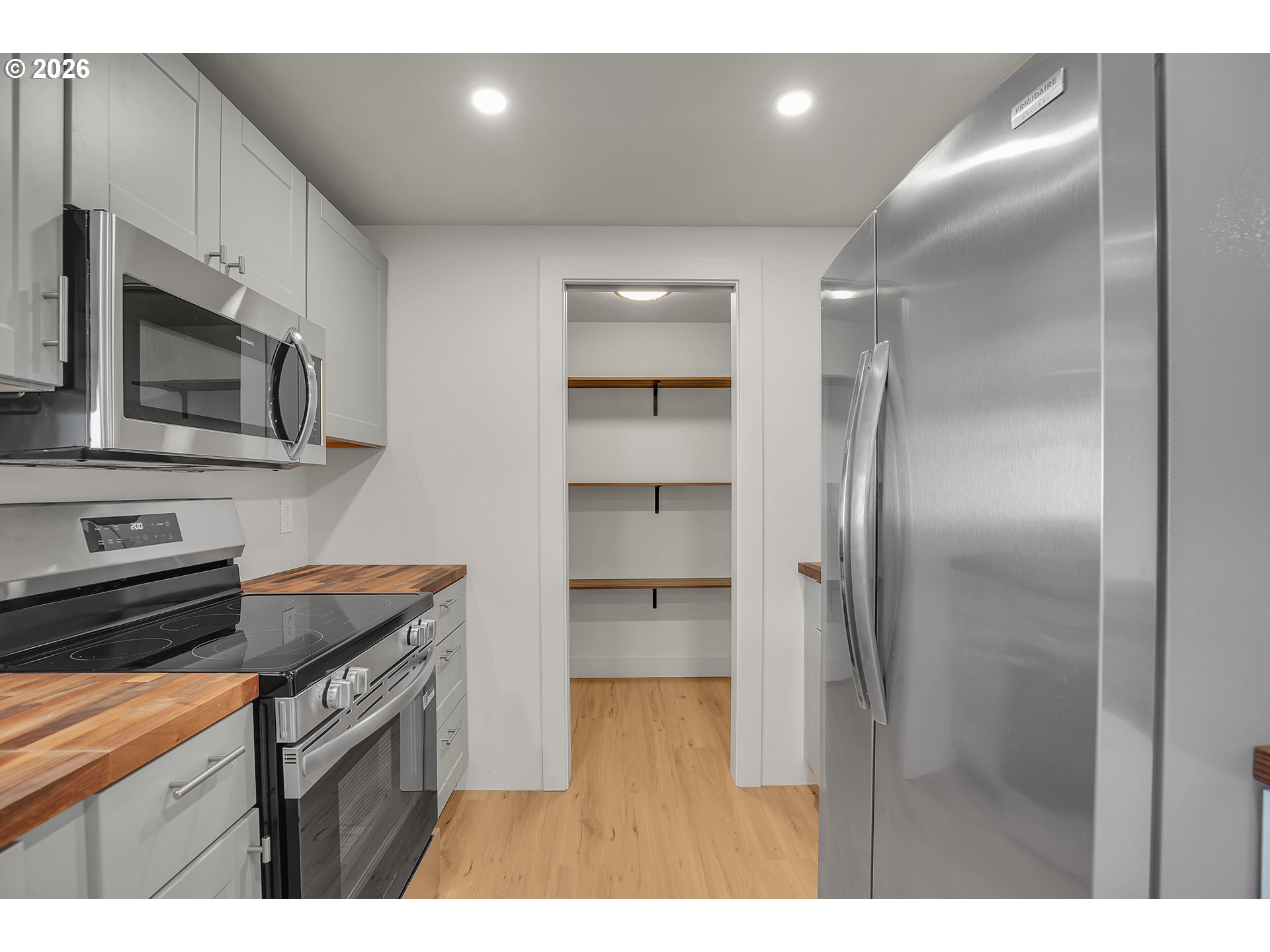 4400 Southeast Roethe Road, Unit 51 Milwaukie, OR 97267 - Photo 17 of 48 a kitchen with stainless steel appliances granite countertop a refrigerator a stove and a sink