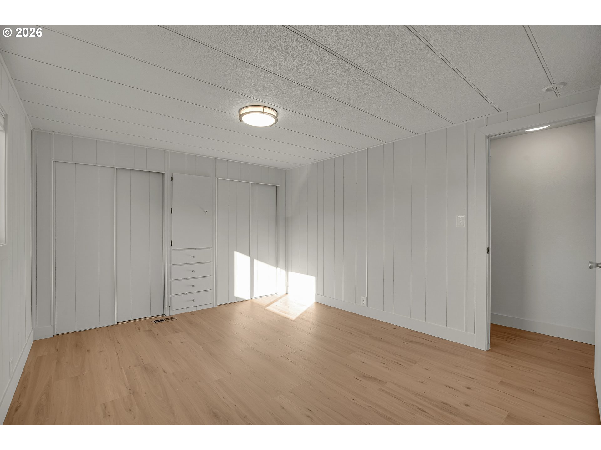 4400 Southeast Roethe Road, Unit 51 Milwaukie, OR 97267 - Photo 29 of 48 a view of an empty room and wooden floor