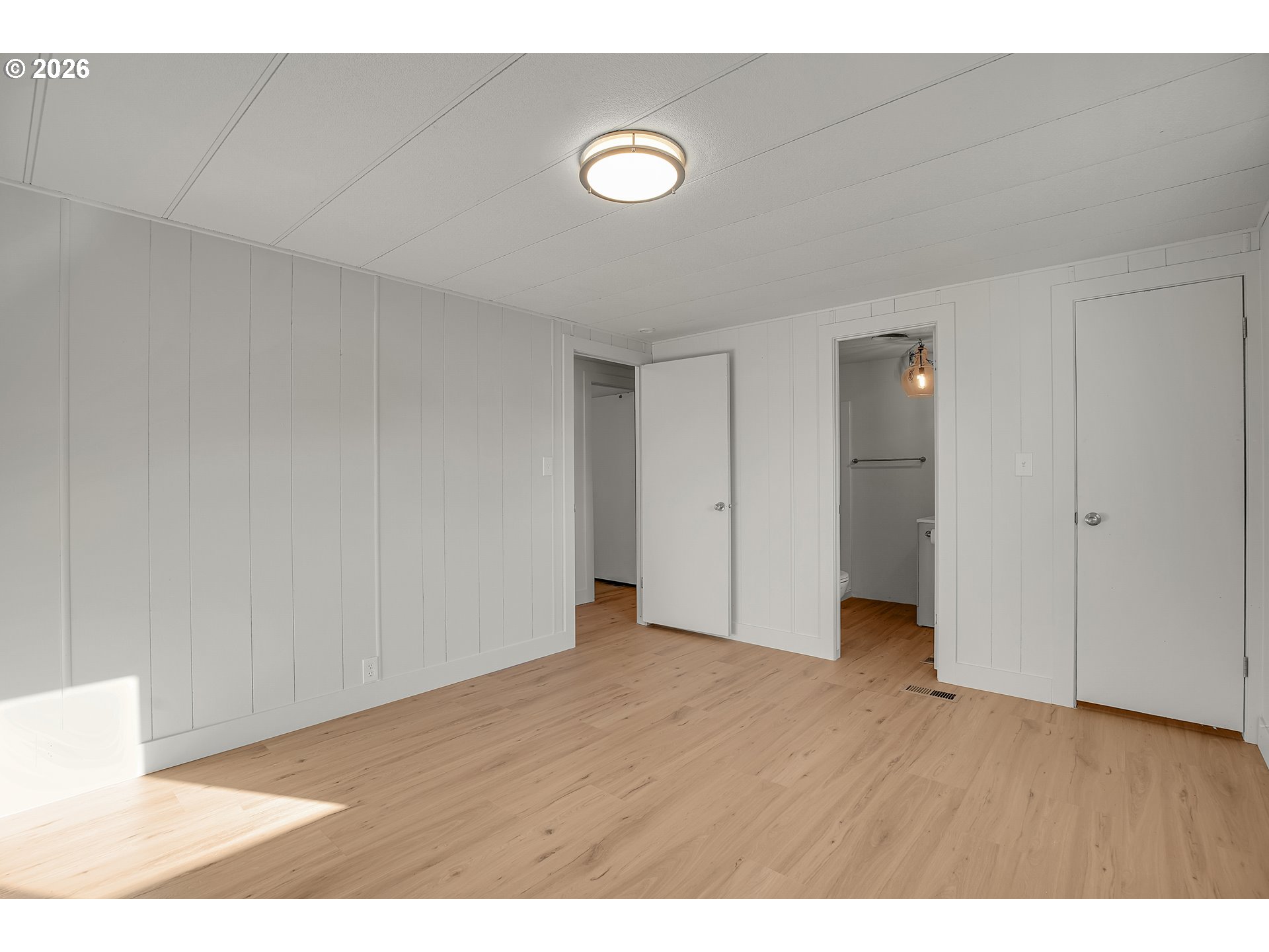 4400 Southeast Roethe Road, Unit 51 Milwaukie, OR 97267 - Photo 30 of 48 a view of an empty room and wooden floor