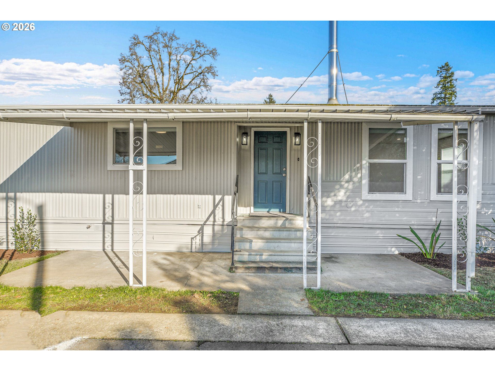 4400 Southeast Roethe Road, Unit 51 Milwaukie, OR 97267 - Photo 3 of 48 a view of a house with a porch