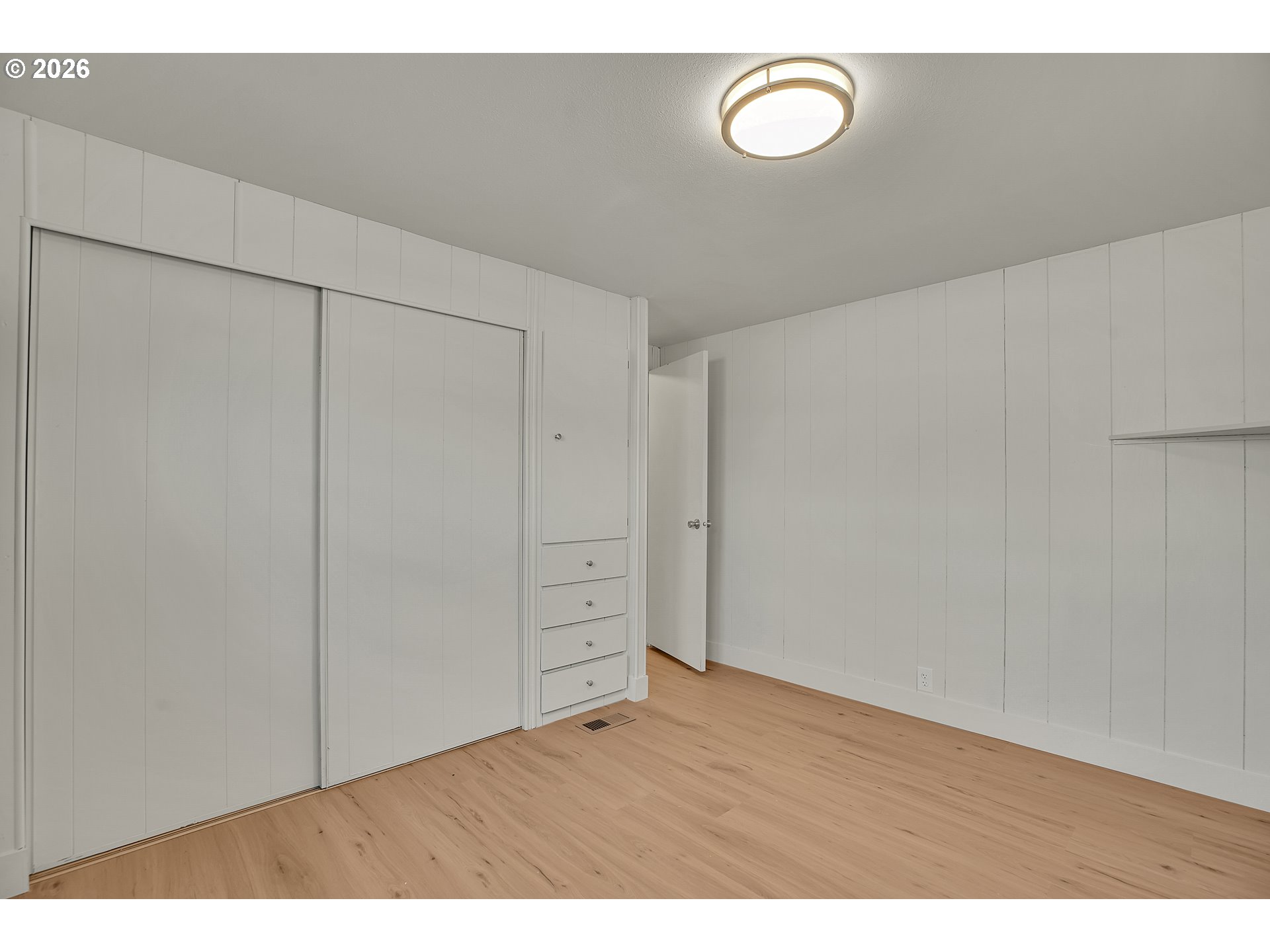 4400 Southeast Roethe Road, Unit 51 Milwaukie, OR 97267 - Photo 34 of 48 a view of an empty room with wooden floor