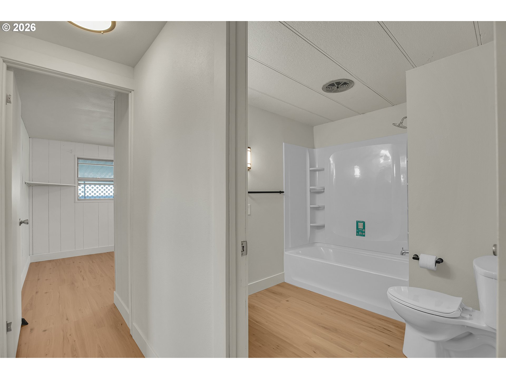 4400 Southeast Roethe Road, Unit 51 Milwaukie, OR 97267 - Photo 35 of 48 a bathroom with a tub shower vanity and a sink