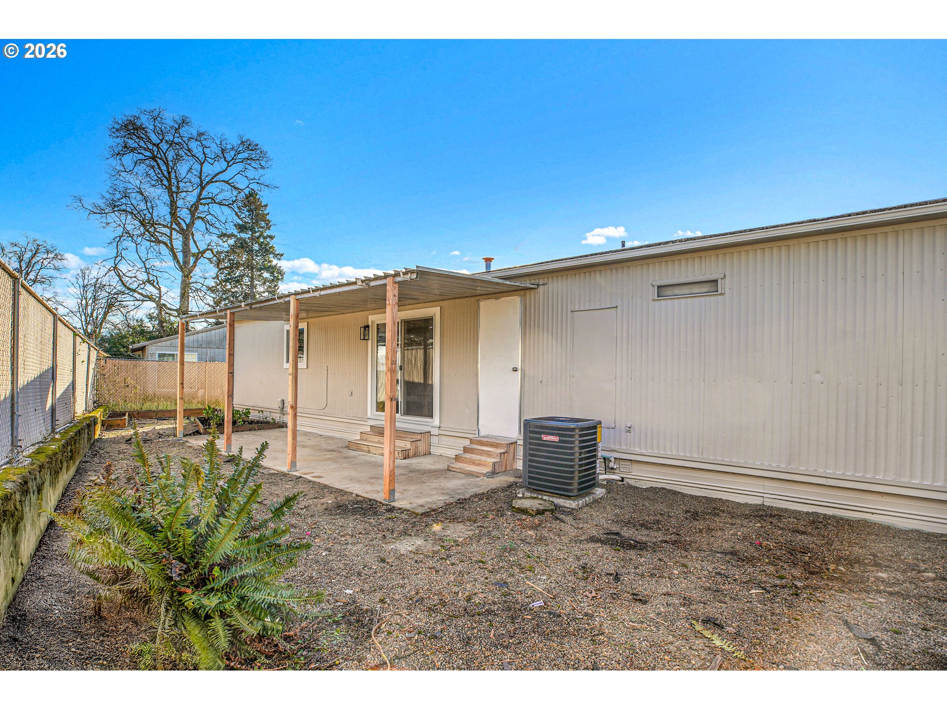 4400 Southeast Roethe Road, Unit 51 Milwaukie, OR 97267 - Photo 40 of 48 a backyard of a house with table and chairs
