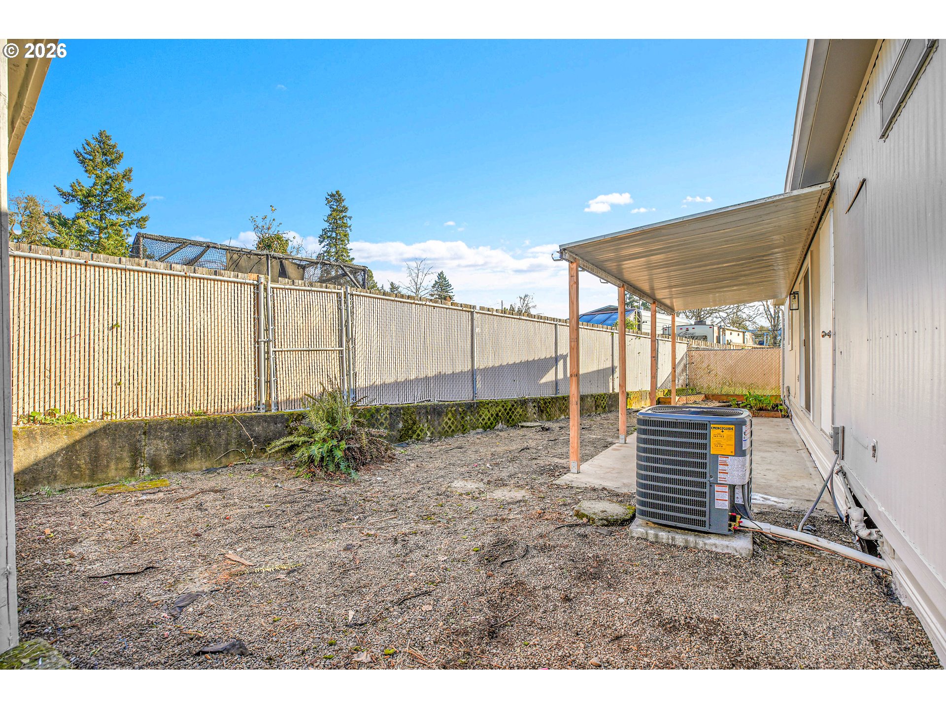 4400 Southeast Roethe Road, Unit 51 Milwaukie, OR 97267 - Photo 41 of 48 a backyard of a house with lots of green space