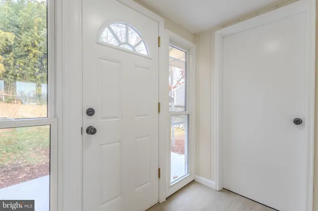 a view of a room with storage and racks on wall