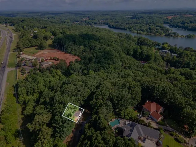 an aerial view of a city with lots of residential buildings and green space