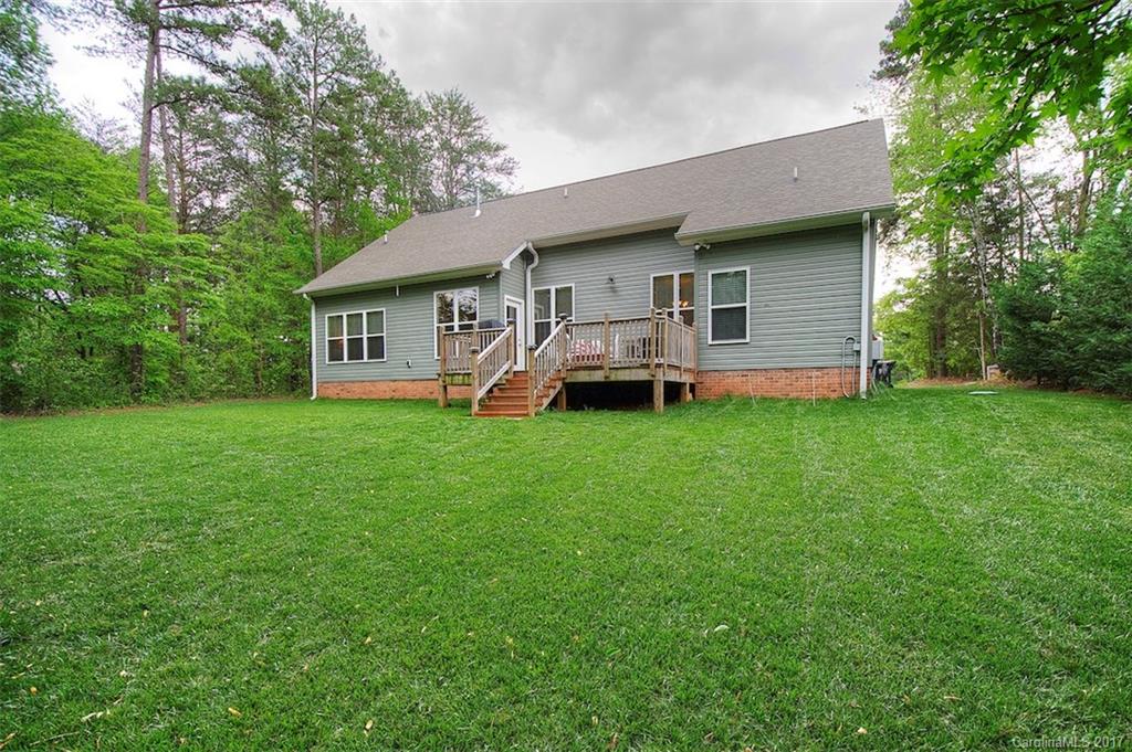 8685 Unity Church Road Denver, NC 28037 - Photo 3 of 24 a view of a house with a yard and sitting area