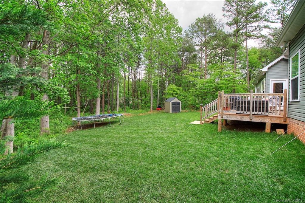8685 Unity Church Road Denver, NC 28037 - Photo 4 of 24 a view of a chair and table in the garden