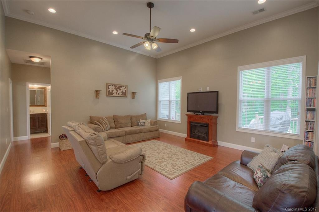 8685 Unity Church Road Denver, NC 28037 - Photo 8 of 24 a living room with furniture and a flat screen tv