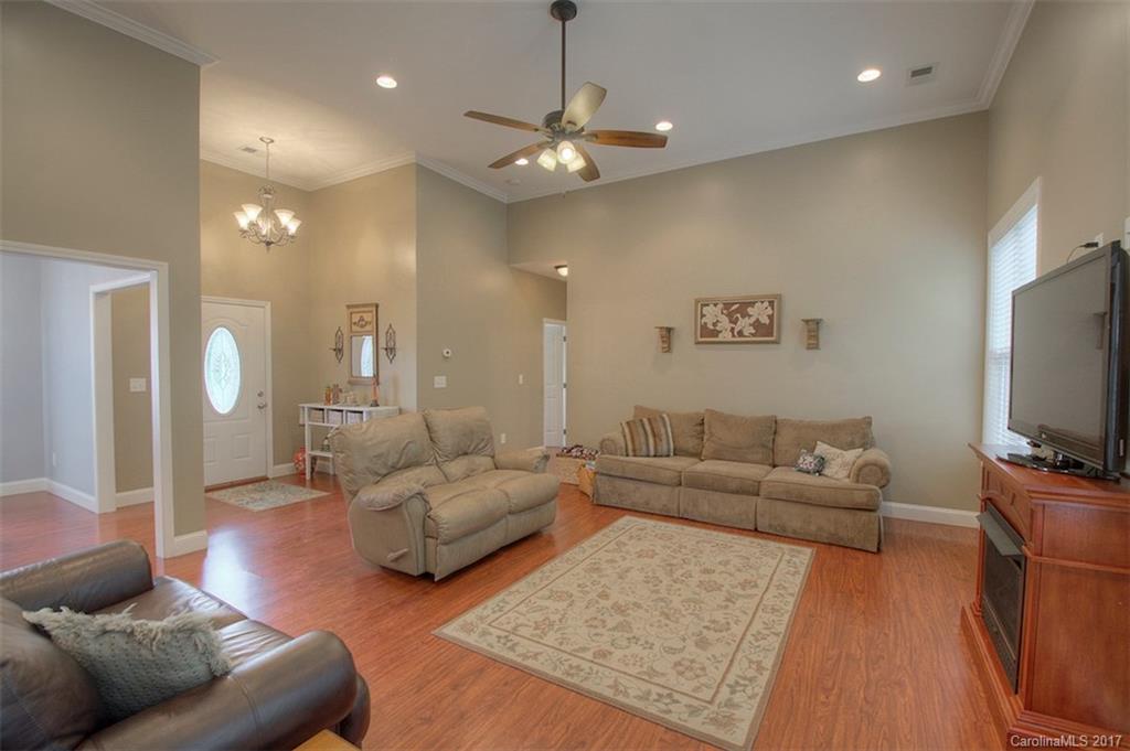 8685 Unity Church Road Denver, NC 28037 - Photo 10 of 24 a living room with furniture and a flat screen tv