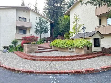 a front view of a house with a yard and a garage