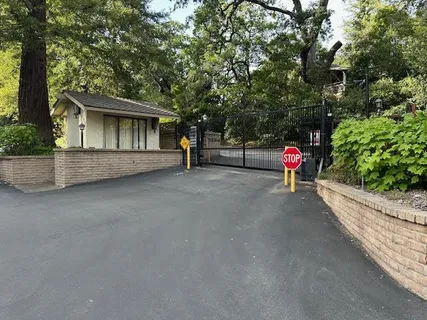 a view of the house with a yard and sitting area