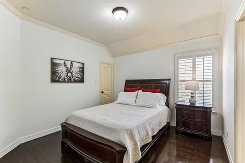 a bedroom with a bed and a closet