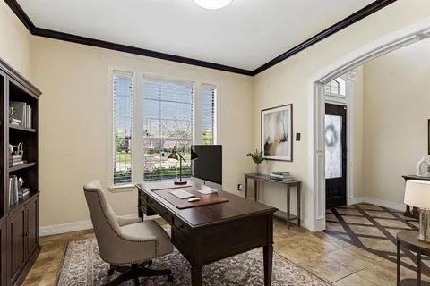 a view of a workspace with furniture