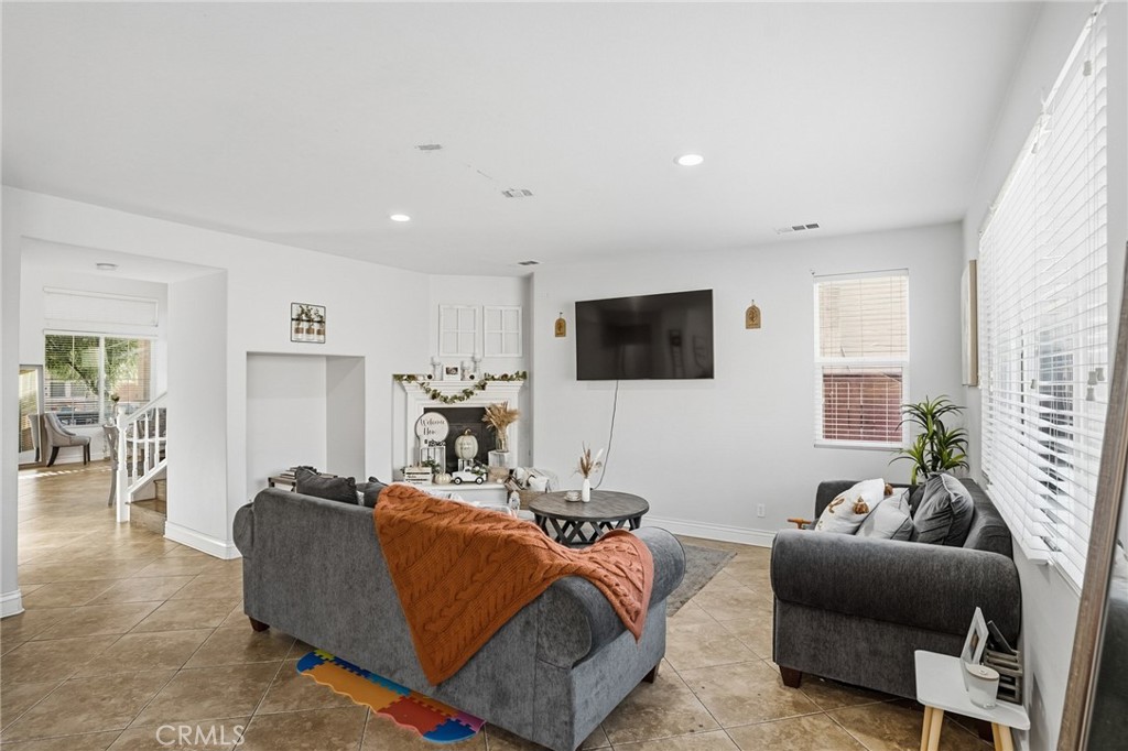 3902 Bluff Street Perris, CA 92571 - Photo 13 of 44 a living room with furniture and a flat screen tv