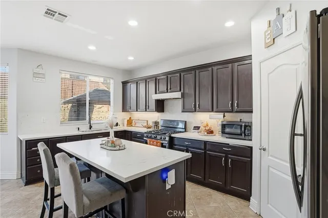 a view of a chairs and table in patio