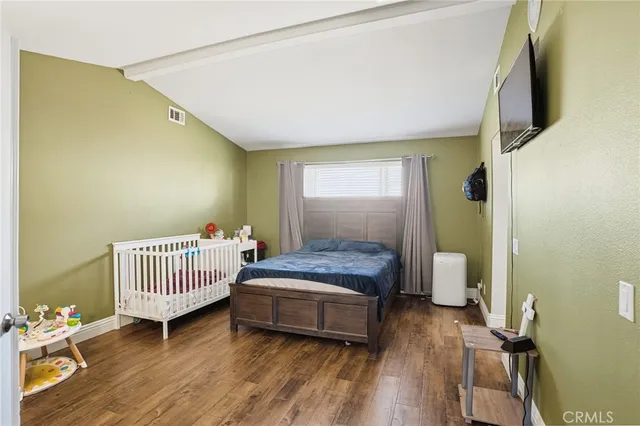 a bedroom with a bed and furniture