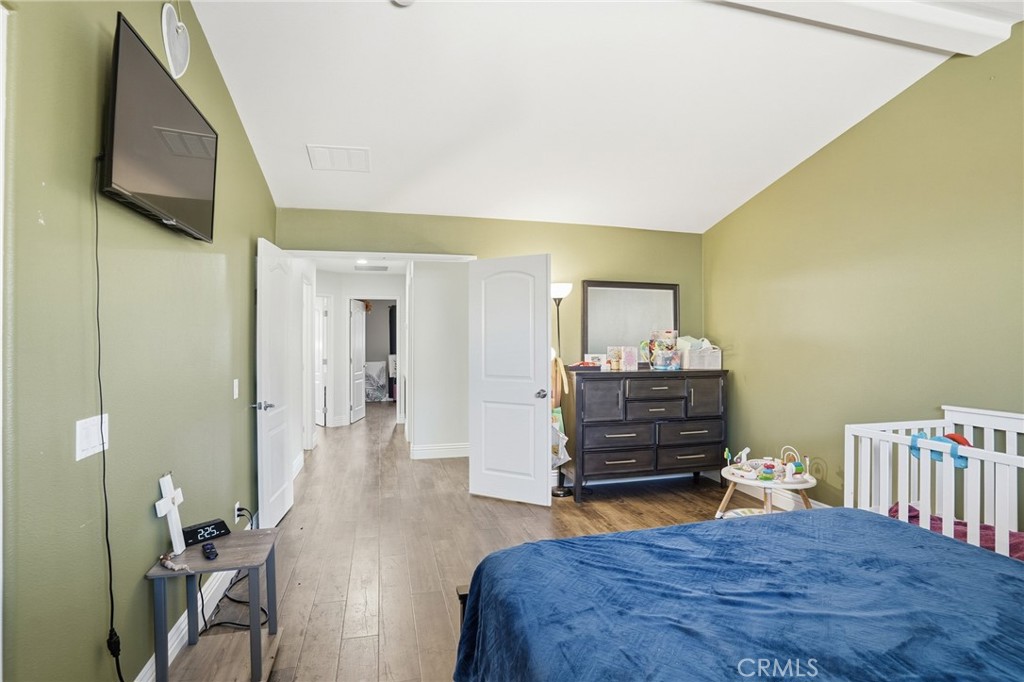 3902 Bluff Street Perris, CA 92571 - Photo 27 of 44 a bedroom with a bed and furniture