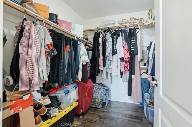 a bathroom with a sink a toilet a mirror and shower curtain