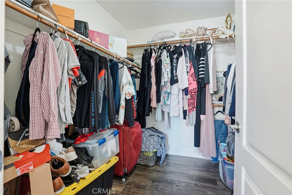 3902 Bluff Street Perris, CA 92571 - Photo 31 of 44 a view of walk in closet with clothes and shoes