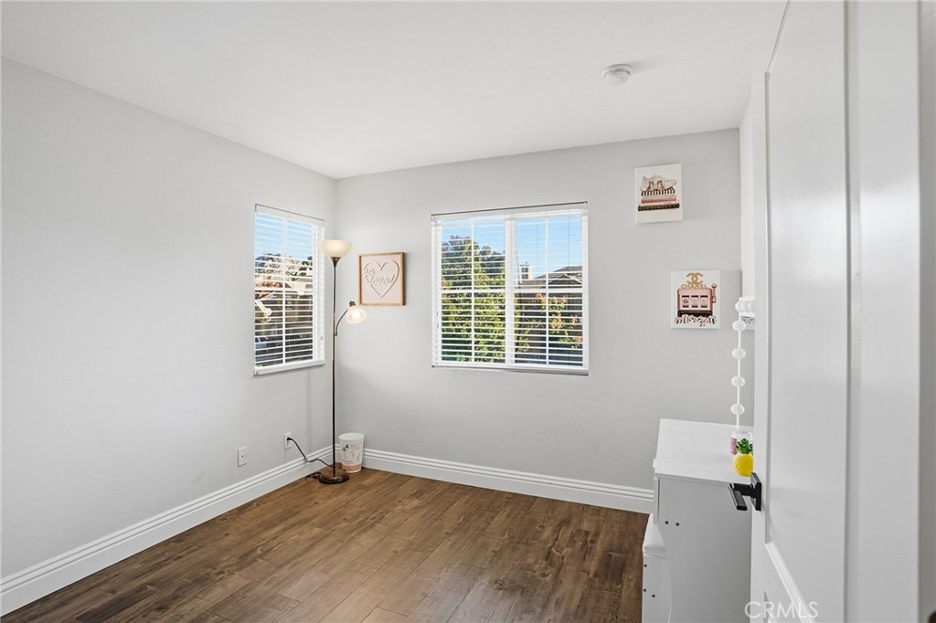 3902 Bluff Street Perris, CA 92571 - Photo 34 of 44 a view of an empty room with wooden floor and a window