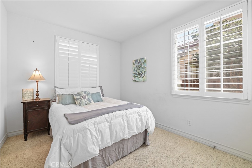 35107 Hogan Drive Beaumont, CA 92223 - Photo 20 of 47 a bedroom with a bed and a window