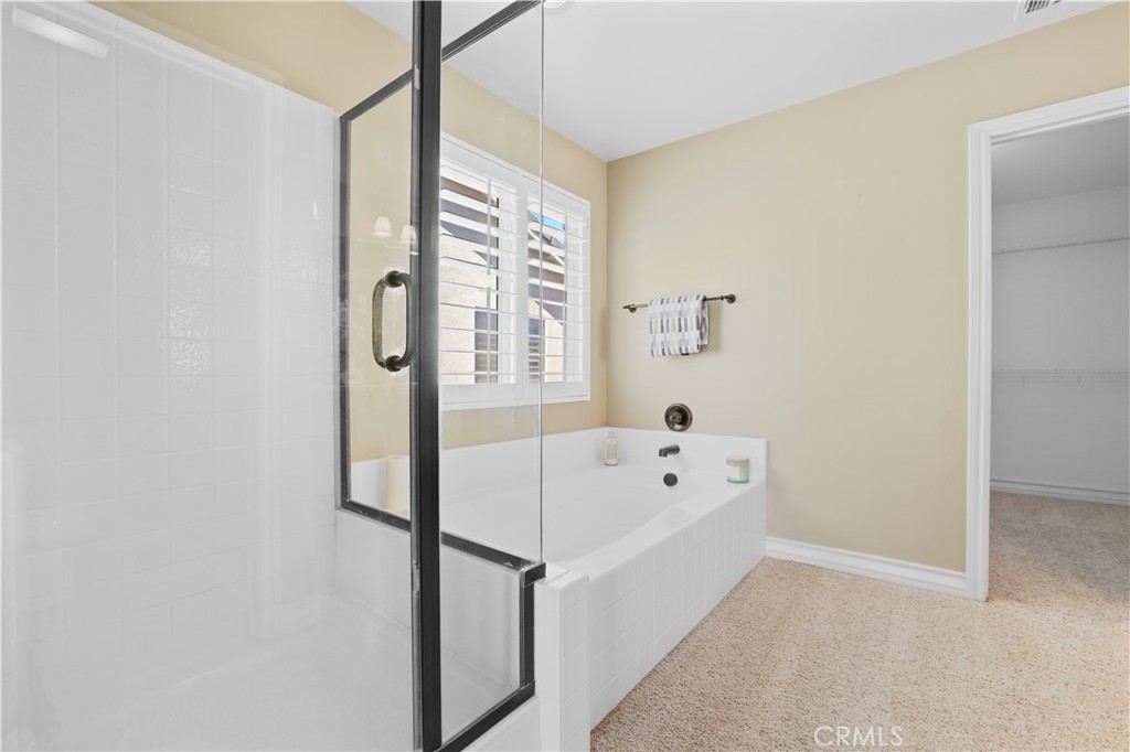 35107 Hogan Drive Beaumont, CA 92223 - Photo 31 of 47 a bathroom with a bathtub and window
