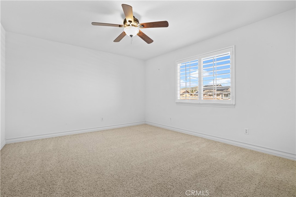 35107 Hogan Drive Beaumont, CA 92223 - Photo 37 of 47 an empty room with a window and a fan