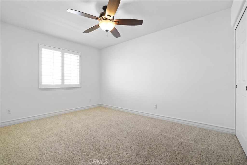 35107 Hogan Drive Beaumont, CA 92223 - Photo 40 of 47 an empty room with a window and a fan