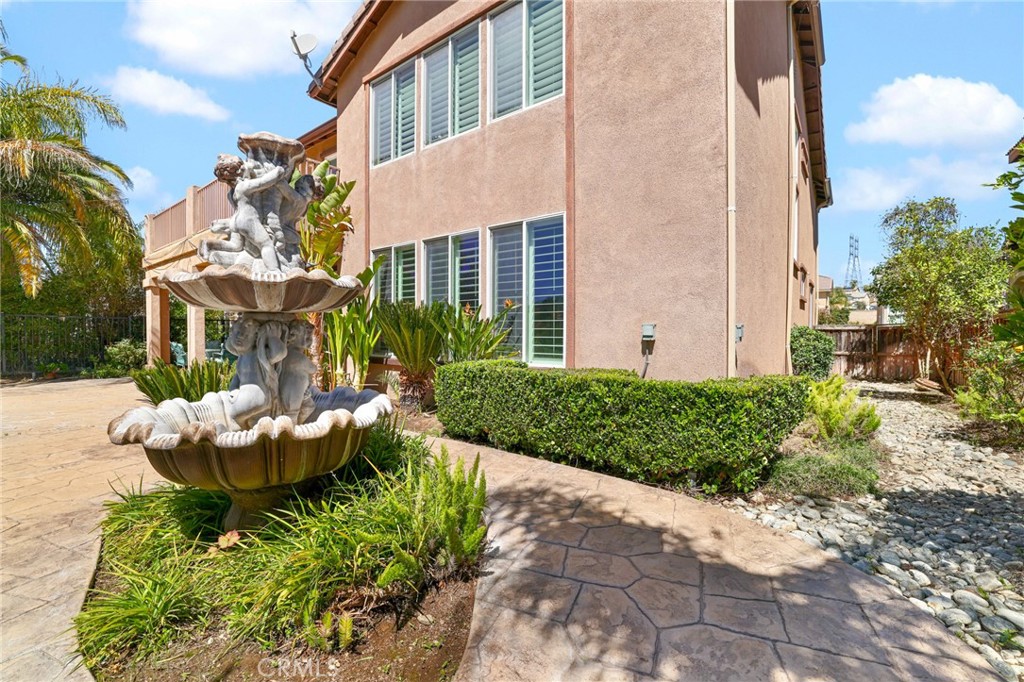 35107 Hogan Drive Beaumont, CA 92223 - Photo 46 of 47 a front view of a house with a yard and fountain