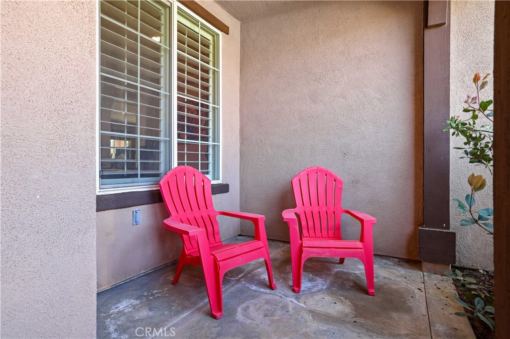 35107 Hogan Drive Beaumont, CA 92223 - Photo 9 of 47 a view of balcony with two chairs and a potted plant