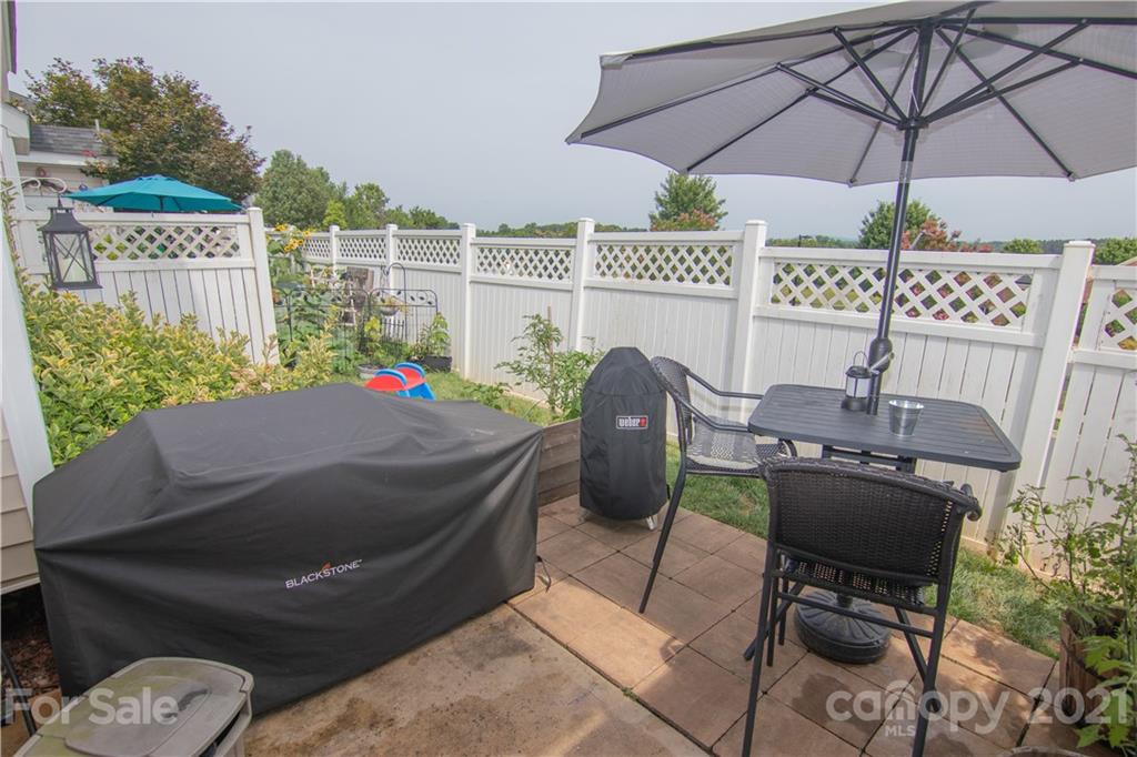 7613 Bluff Point Lane Denver, NC 28037 - Photo 15 of 20 a patio with table and chairs