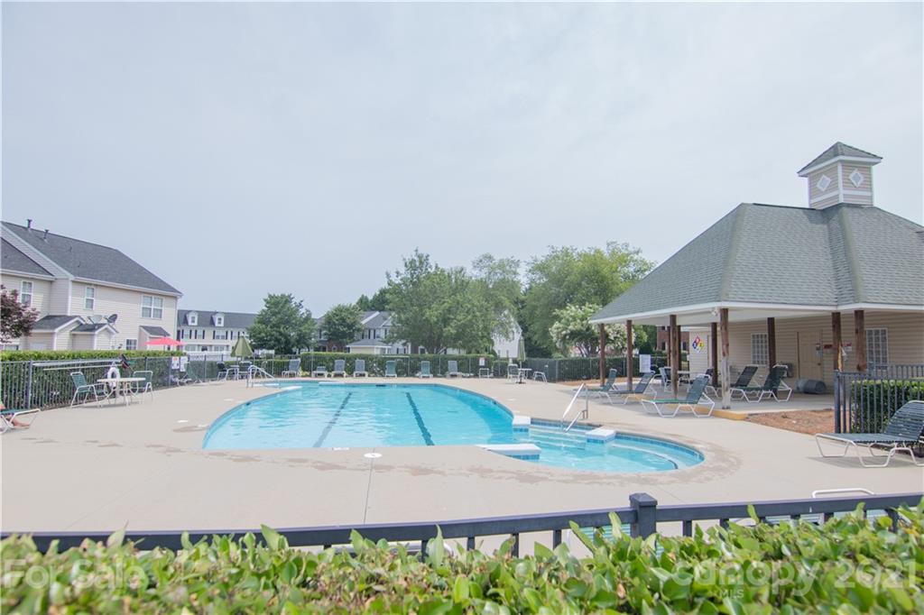 7613 Bluff Point Lane Denver, NC 28037 - Photo 20 of 20 an outdoor space with pool and furniture
