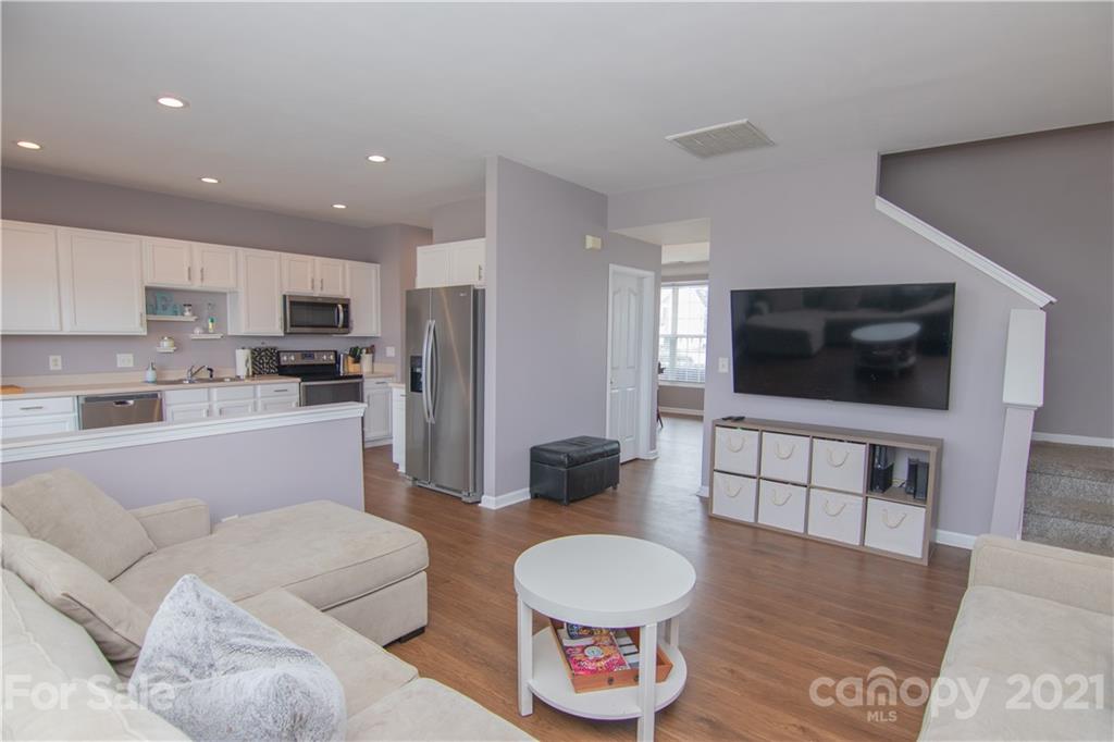 7613 Bluff Point Lane Denver, NC 28037 - Photo 3 of 20 a living room with furniture and a flat screen tv