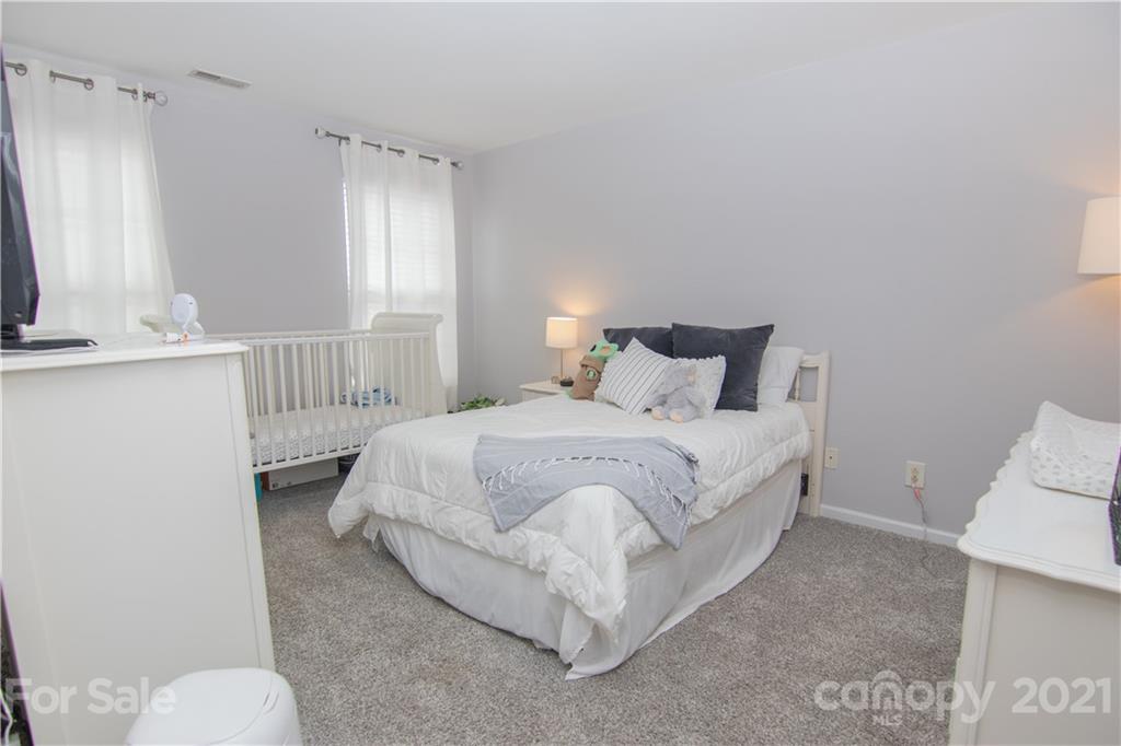 7613 Bluff Point Lane Denver, NC 28037 - Photo 6 of 20 a bedroom with a bed and a window