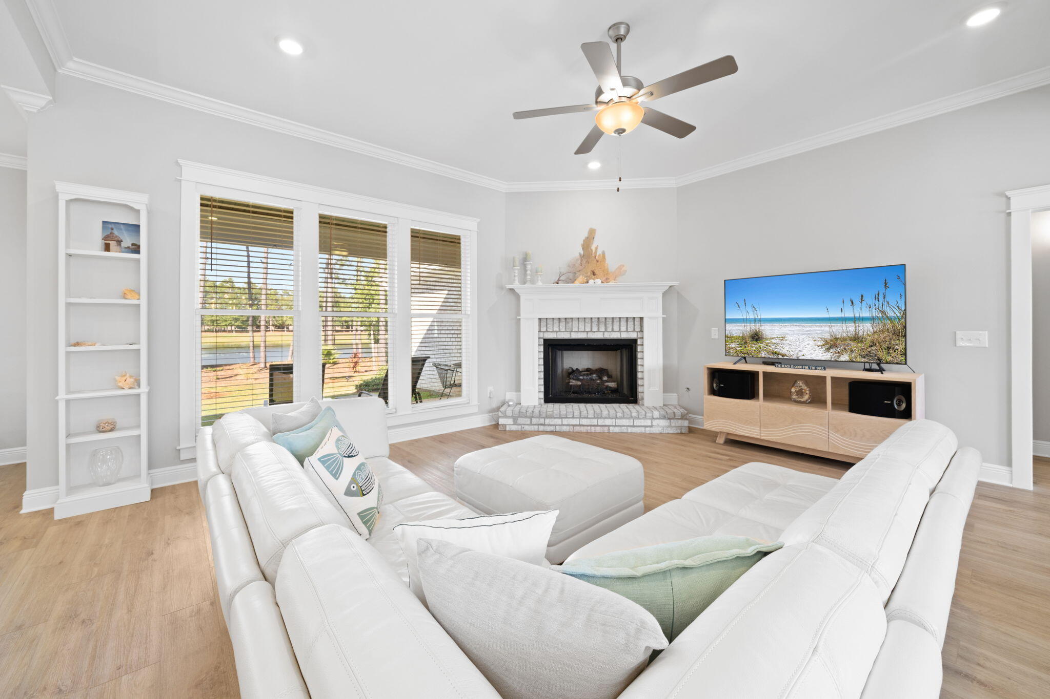142 Mill Pond Cove Freeport, FL 32439 - Photo 16 of 109 a living room with furniture fireplace and a flat screen tv