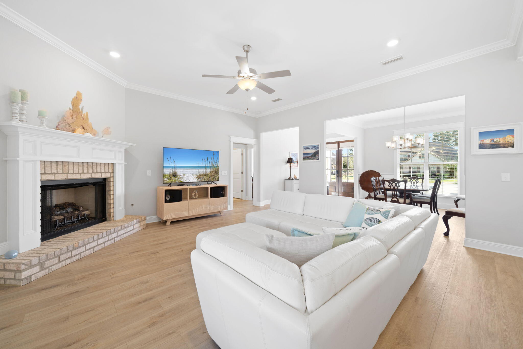 142 Mill Pond Cove Freeport, FL 32439 - Photo 17 of 109 a living room with furniture a fireplace and a flat screen tv
