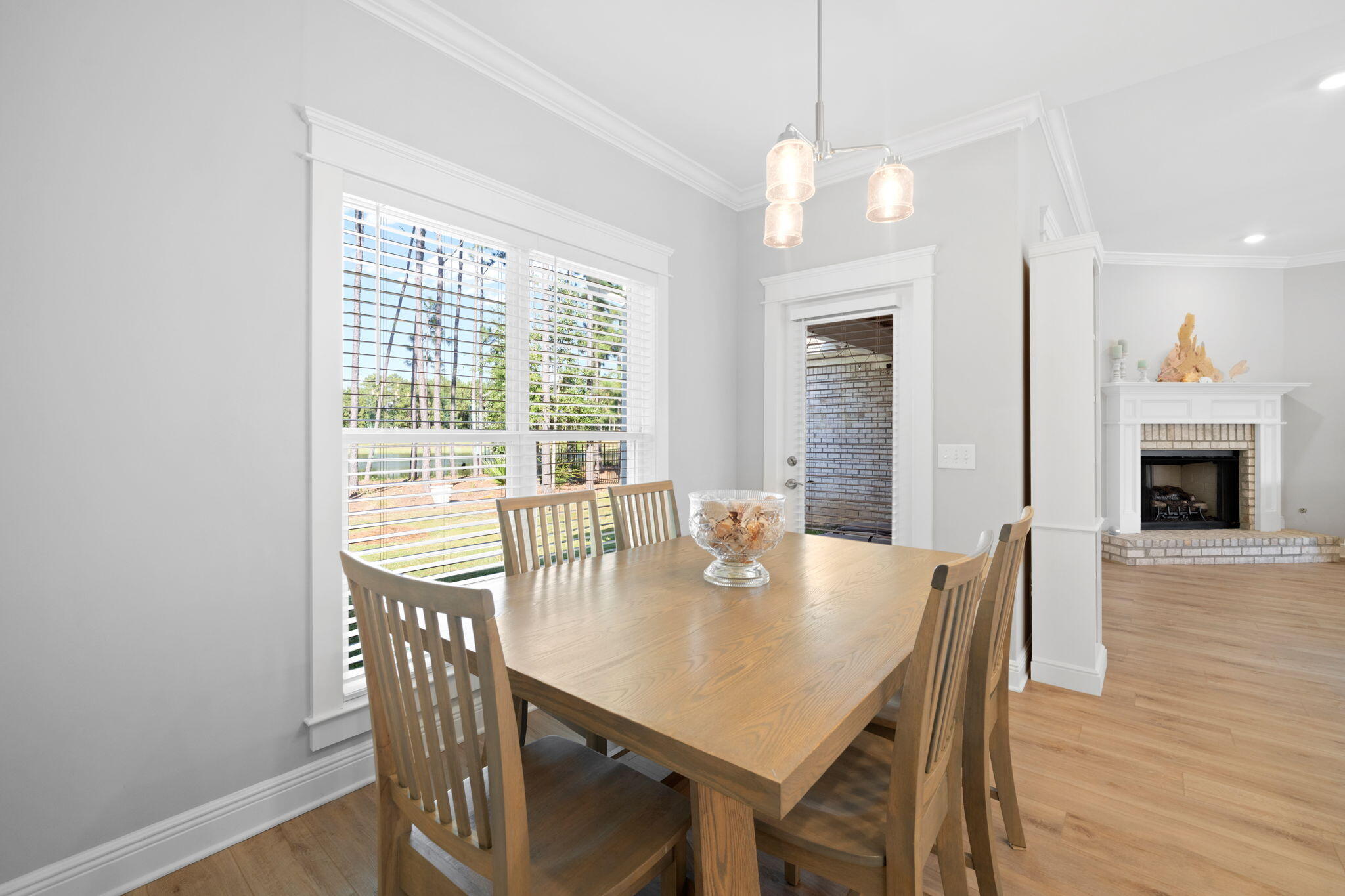142 Mill Pond Cove Freeport, FL 32439 - Photo 24 of 109 a view of a dining room with furniture window and wooden floor