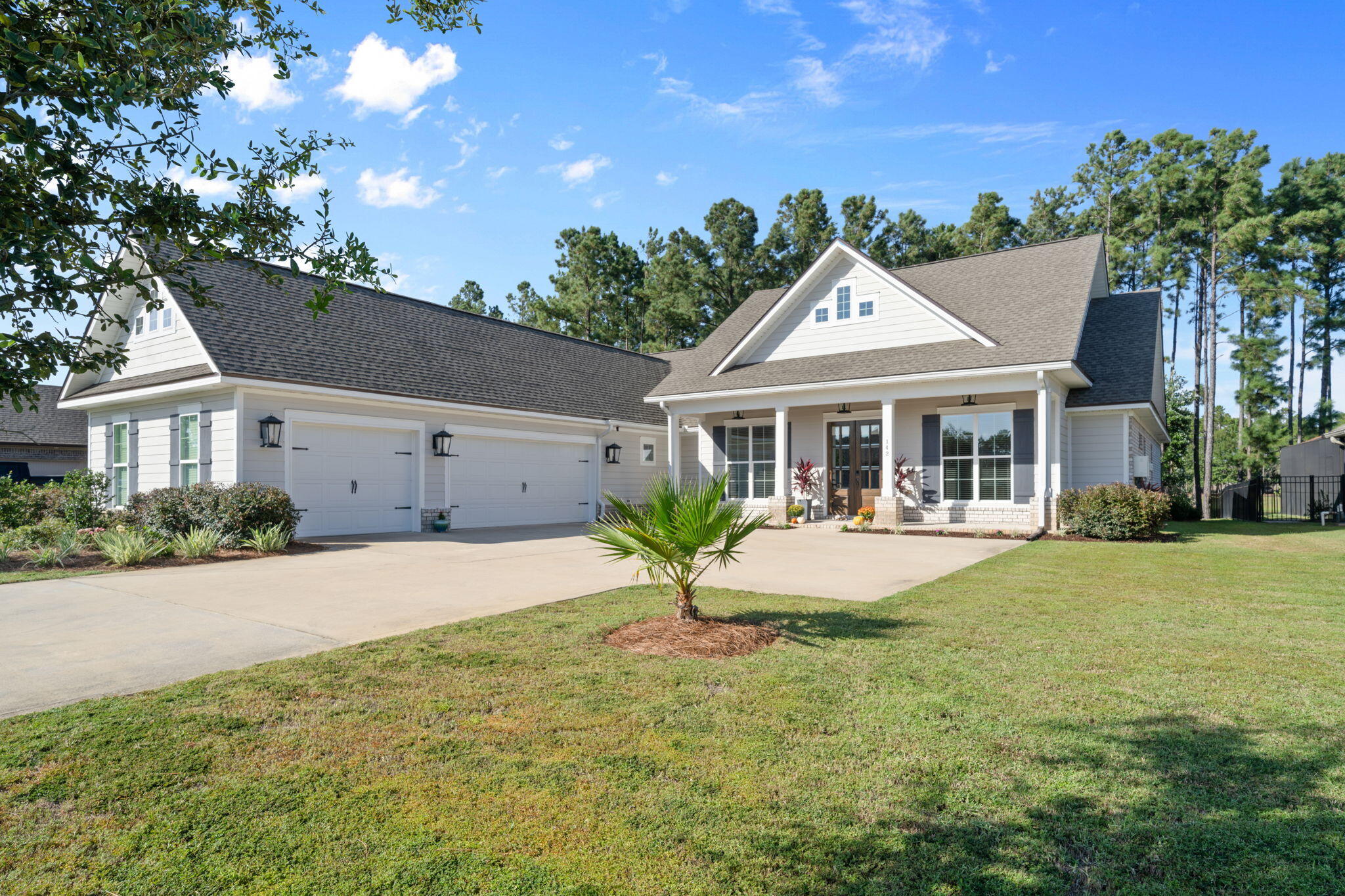 142 Mill Pond Cove Freeport, FL 32439 - Photo 3 of 109 a front view of house with yard and outdoor seating