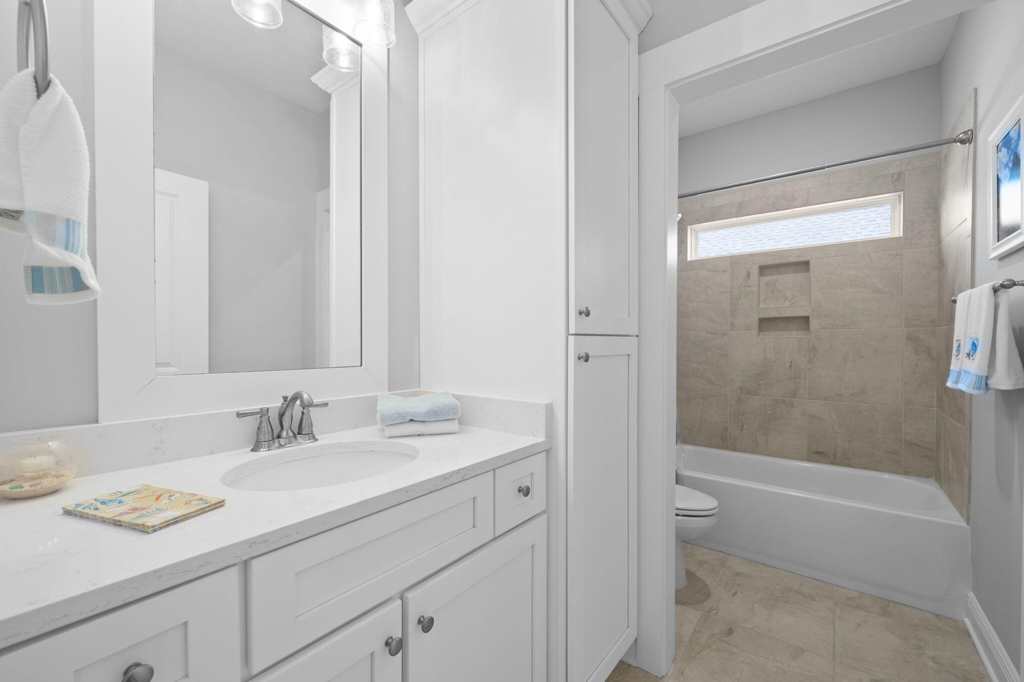 142 Mill Pond Cove Freeport, FL 32439 - Photo 35 of 109 a bathroom with a granite countertop sink a toilet and shower