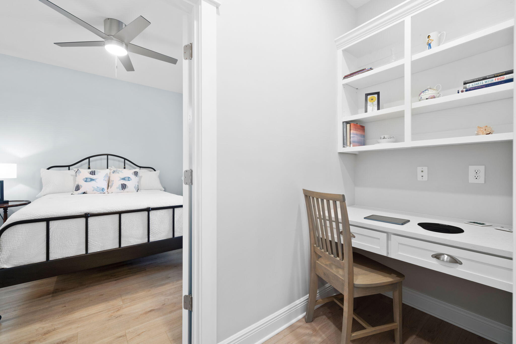 142 Mill Pond Cove Freeport, FL 32439 - Photo 36 of 109 a bedroom with a bed and a chandelier