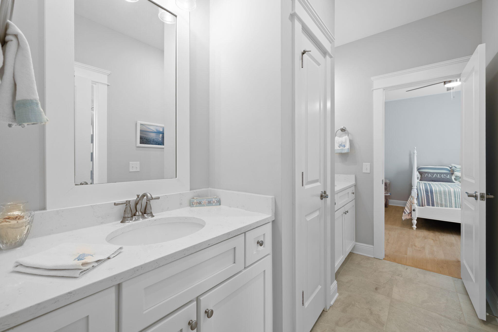 142 Mill Pond Cove Freeport, FL 32439 - Photo 39 of 109 a en suite bathroom with a granite countertop sink and a mirror