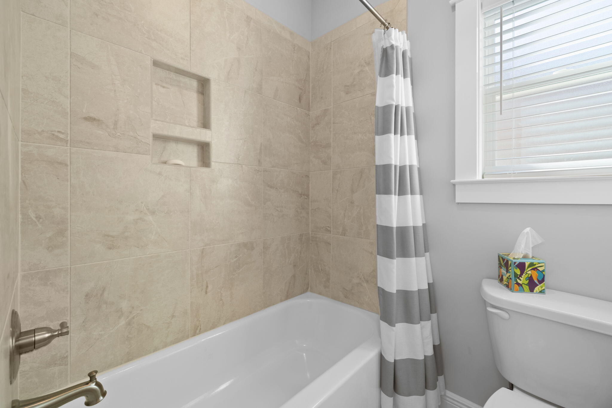 142 Mill Pond Cove Freeport, FL 32439 - Photo 40 of 109 a bath room with a toilet and a bath tub