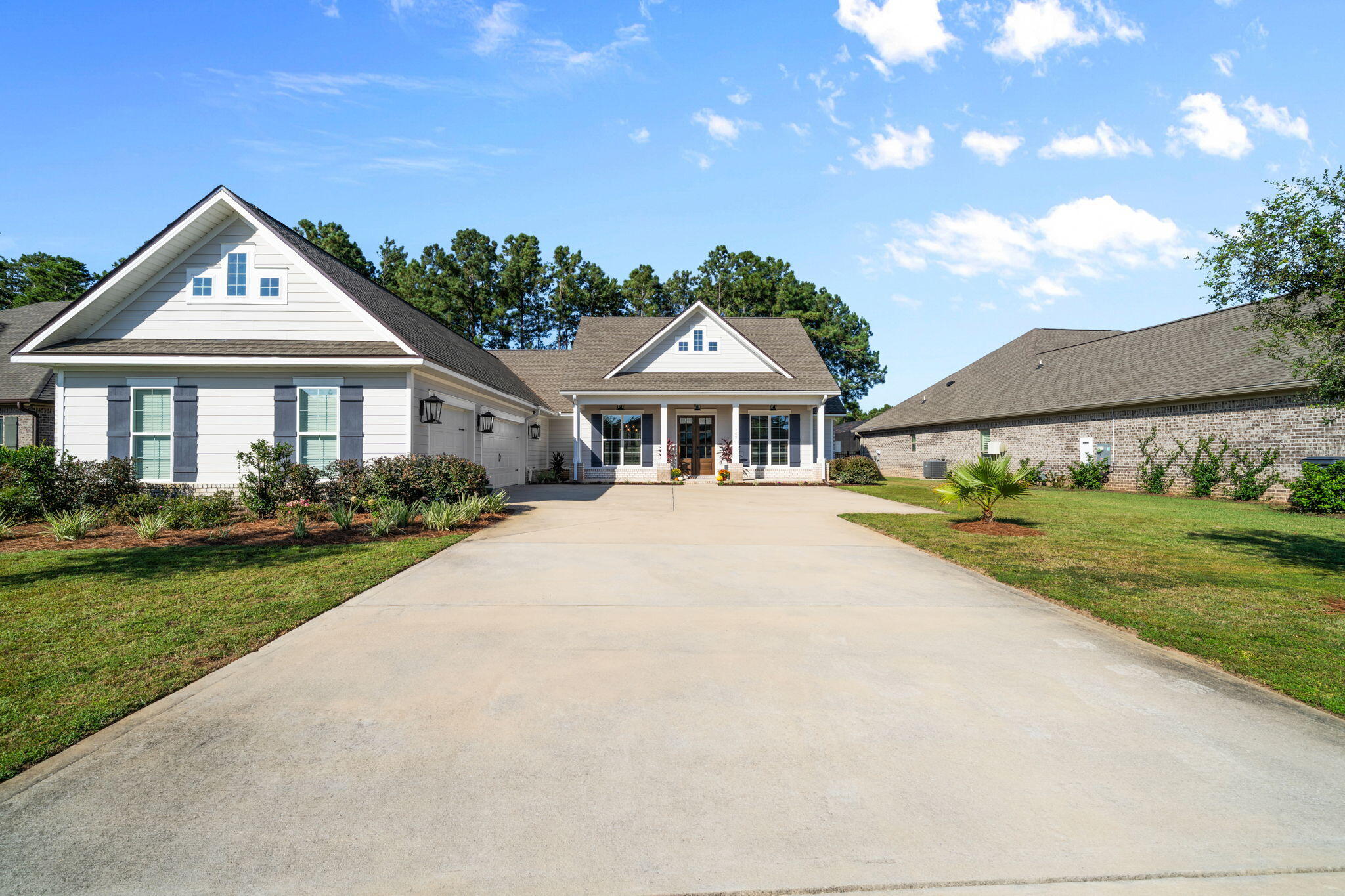 142 Mill Pond Cove Freeport, FL 32439 - Photo 4 of 109 a front view of a house with a yard