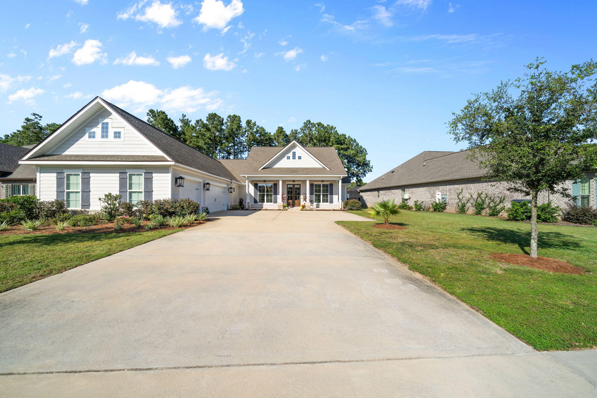 142 Mill Pond Cove Freeport, FL 32439 - Photo 5 of 109 a front view of a house with a yard